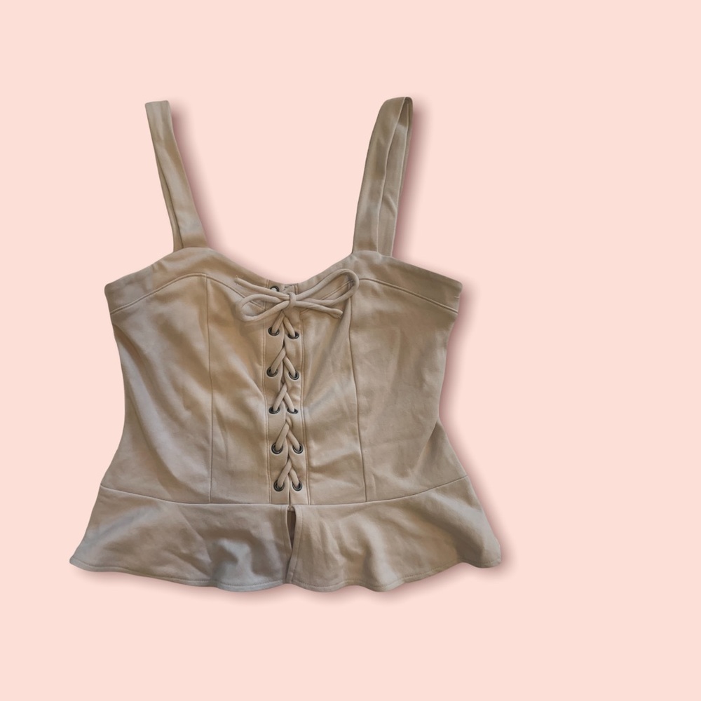 Sleeveless lace-up peplum top
